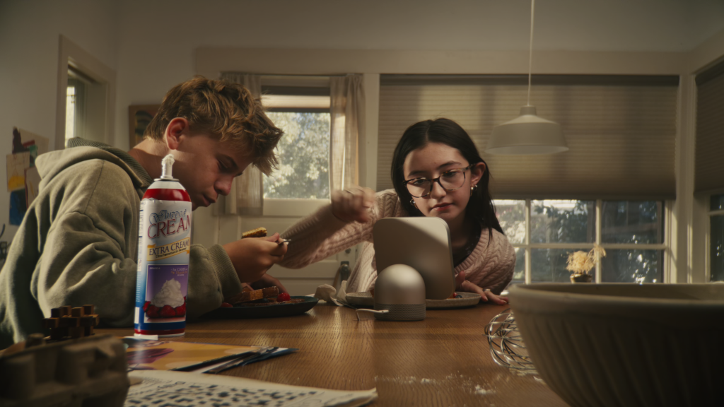 Family members engaged in using the HomeView at breakfast